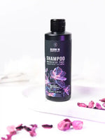 Зареди изображението в галерията, Бутилка шампоан Bloom 16 молекулярен шампоан 250 мл с флорални акценти на бял фон.