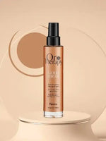 Зареди изображението в галерията, Oro Therapy Gold hydrating serum bottle on a minimalistic display, highlighting its moisturizing and shine-enhancing properties.
